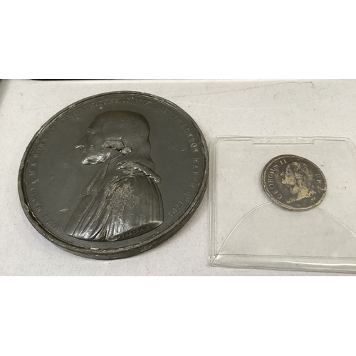 297 - Tin of miscellaneous English and foreign coins including George II half guinea coin weight, Wesleyan... 