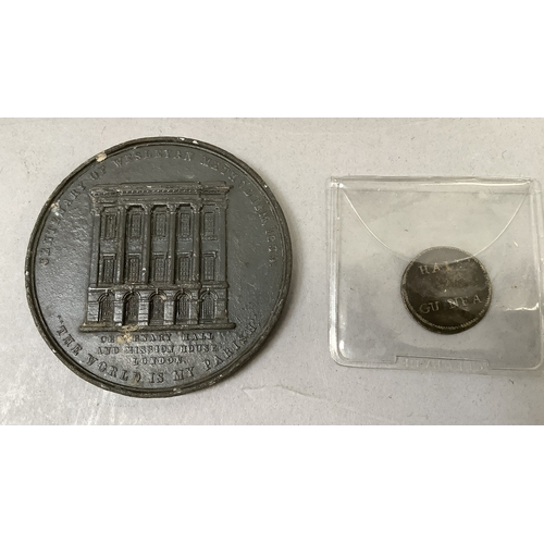 297 - Tin of miscellaneous English and foreign coins including George II half guinea coin weight, Wesleyan... 