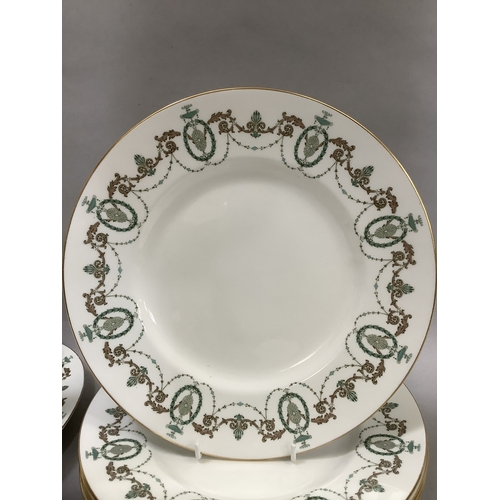 304 - A Minton dinner service of Adam design comprising six dinner plates, six dessert plates, six side pl... 