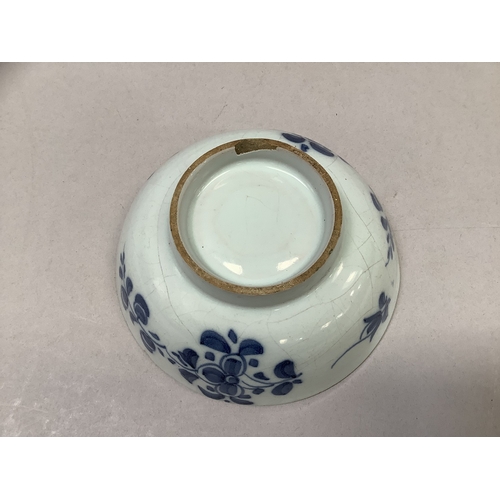 322 - A tin glaze bowl painted with flowers to the exterior and well on deep foot rim, measuring 12.75cm d... 