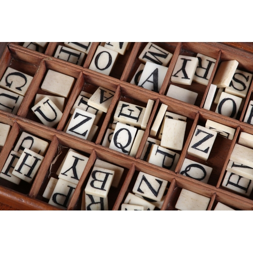 42 - A VICTORIAN SET OF BONE ALPHABET SPELLING TILES, contained in a divided tray-box with sliding lid, a... 