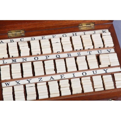 41 - A VICTORIAN SET OF BONE ALPHABET SPELLING TILES, contained in a fitted mahogany box with lettered co... 