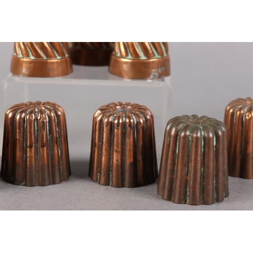 31 - A SET OF SIX LATE 19TH CENTURY MINIATURE COPPER MOULDS of reeded form, each stamped '53', 4cm diamet... 