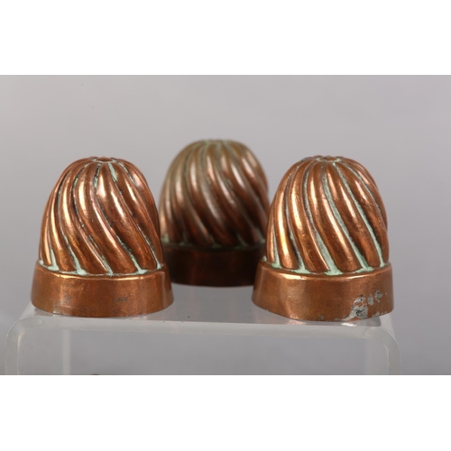 31 - A SET OF SIX LATE 19TH CENTURY MINIATURE COPPER MOULDS of reeded form, each stamped '53', 4cm diamet... 