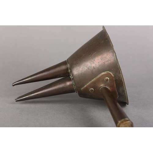 36 - AN EARLY 20TH CENTURY EGG THREAD FUNNEL, copper, tin lined on a turned treen handle, 29cm long