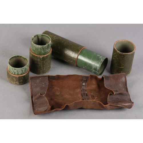 18 - A 19TH CENTURY GREEN LEATHER COVERED TRAVEL WRITING CASE of tube form, containing a leather quill wr... 