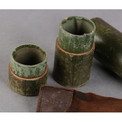 18 - A 19TH CENTURY GREEN LEATHER COVERED TRAVEL WRITING CASE of tube form, containing a leather quill wr... 