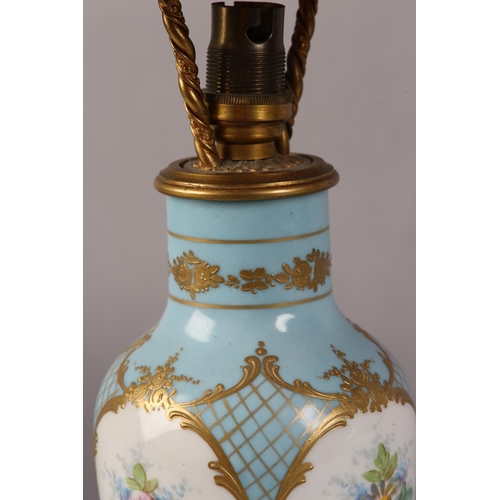 38 - A PAIR OF PALE BLUE AND GILT CHINA TABLE LAMPS painted in polychrome enamels with flowers within fou... 