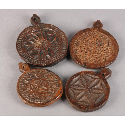 22 - FOUR 19TH CENTURY WOODEN MOULDS for butter or bread making, each carved different geometrical design... 