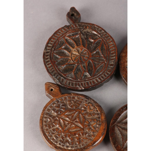 22 - FOUR 19TH CENTURY WOODEN MOULDS for butter or bread making, each carved different geometrical design... 