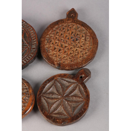 22 - FOUR 19TH CENTURY WOODEN MOULDS for butter or bread making, each carved different geometrical design... 