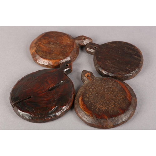 22 - FOUR 19TH CENTURY WOODEN MOULDS for butter or bread making, each carved different geometrical design... 
