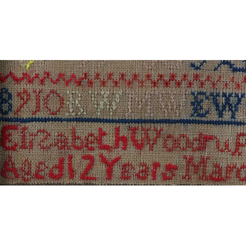 12 - A MID 19TH CENTURY SAMPLER by Elizabeth Woodrup Aged 12 Years March 22 1854, with alphabet and numbe... 