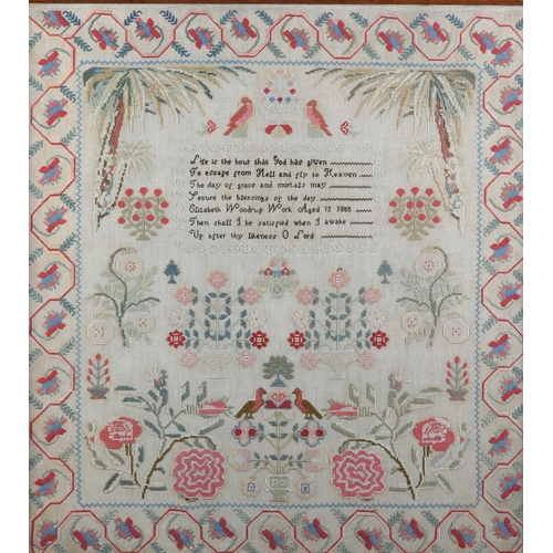 13 - A MID 19TH CENTURY SAMPLER by Elizabeth Woodrup Aged 13 1855, worked in coloured wools on linen with... 