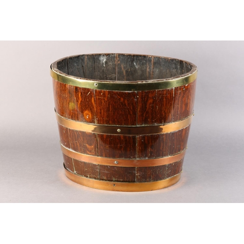 49 - A 19TH CENTURY OAK, BRASS AND COPPER BOUND BARREL, of oval outline, 40cm x 34cm x 32cm high (no base... 