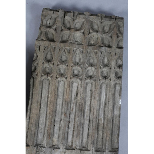 23 - A 16TH CENTURY OAK GOTHIC PANEL CARVED WITH TRACERY, 47cm high x 25.5cm wide x 4cm deep, together wi... 