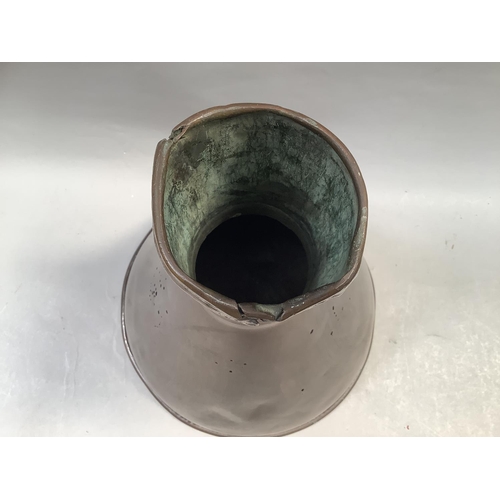 43 - A large copper funnel shaped vessel, the body having scattered holes, 47.5cm high x 34.5cm diameter