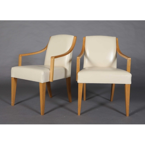 14 - A pair of pale oak and cream leather side chairs, on square tapered legs