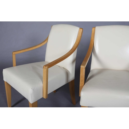 14 - A pair of pale oak and cream leather side chairs, on square tapered legs