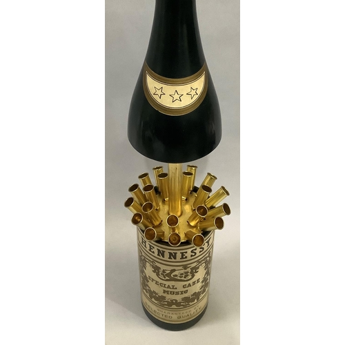 35 - A musical Hennessy bottle cigarette dispenser, 32cm closed, 42cm open
