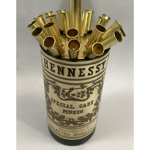 35 - A musical Hennessy bottle cigarette dispenser, 32cm closed, 42cm open