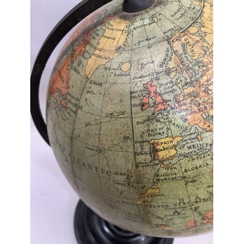 33 - A 1930s Philips' 6in Terrestrial Globe, made for the London Geographical Institution, on an ebonised... 