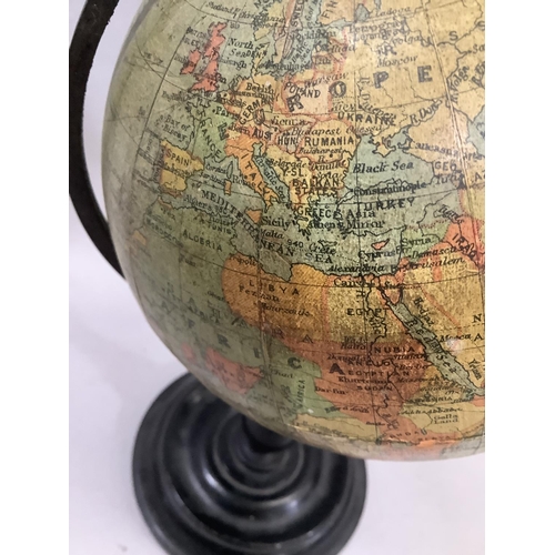 33 - A 1930s Philips' 6in Terrestrial Globe, made for the London Geographical Institution, on an ebonised... 