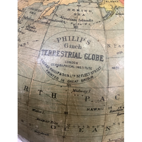 33 - A 1930s Philips' 6in Terrestrial Globe, made for the London Geographical Institution, on an ebonised... 