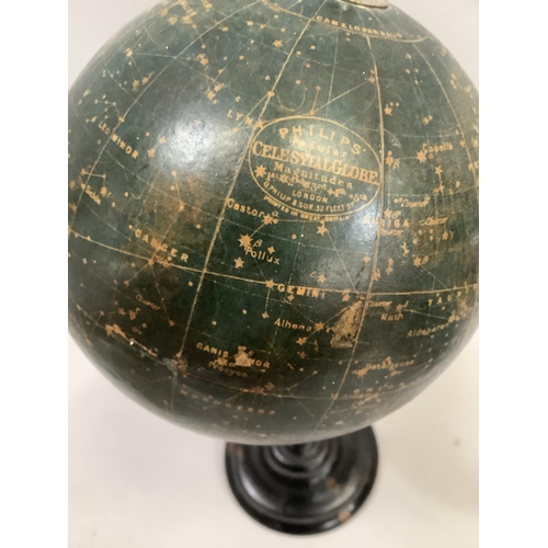 34 - A 1930s Philips' Popular Celestial Globe Magnitudes 1st, 2nd, 3rd, 4th and 5th, on an ebonised turne... 