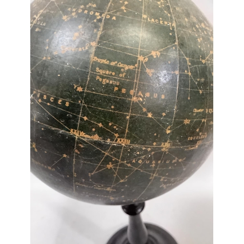 34 - A 1930s Philips' Popular Celestial Globe Magnitudes 1st, 2nd, 3rd, 4th and 5th, on an ebonised turne... 