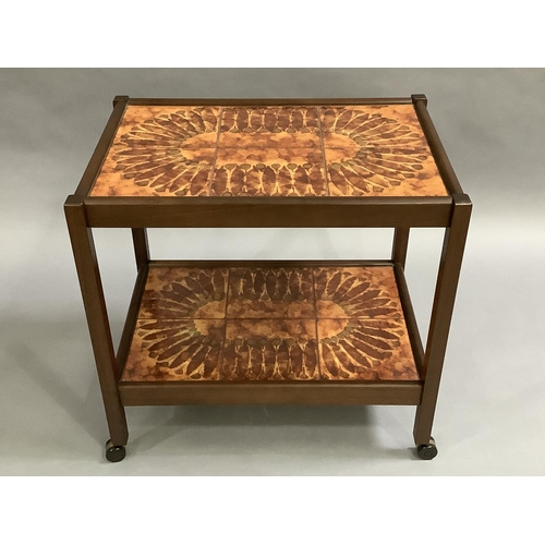 37 - A teak and tile inset two tier trolley c1960s, the tiles glazed in orange and olive green oval flowe... 