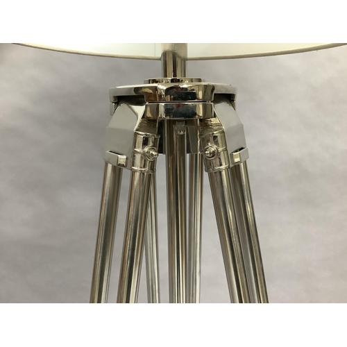 38 - A contemporary brushed and polished white metal and wood tripod standard lamp, adjustable height, wi... 