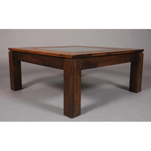 47 - A brutalist oak and glass inset coffee table, on square legs, 100cm square x 45cm high