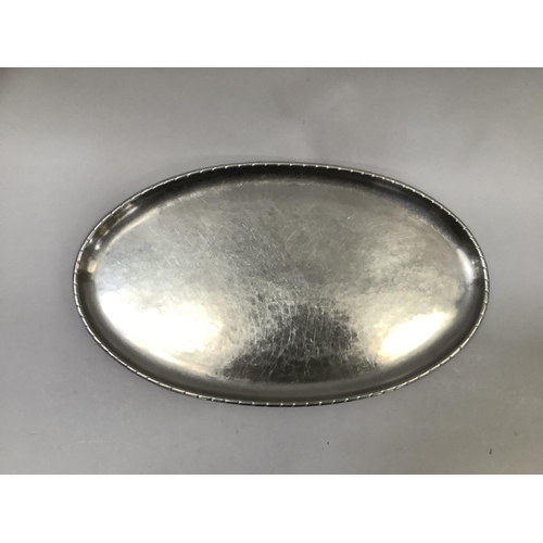 51 - Keswick School of Industrial Art, steel oval tray with oblique notch rim, stamped no. D389 KSAI Kesw... 
