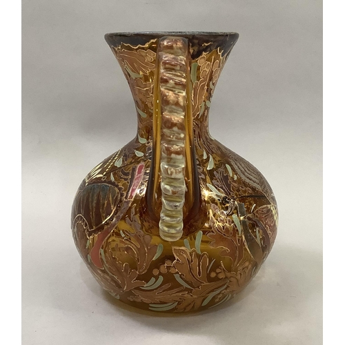 17 - A hand painted Spanish two handled vase in amber glass 18.5cm high