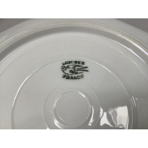 21 - A Limoges porcelain plate polychrome enamelled with tulips and other blooms, moulded rim 18cm togeth... 