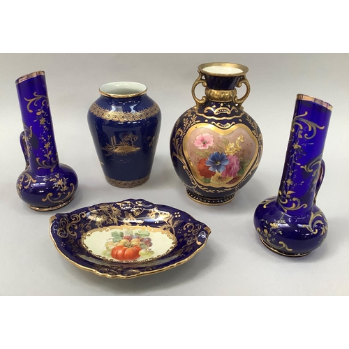 23 - A Crescent china two handled vase painted with reserves of flowers against a dark blue and gilt grou... 