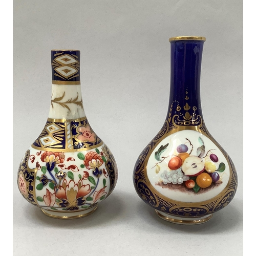 26 - A 19th century Derby vase painted with fruits within a gilt cartouche on a dark blue ground crowned ... 