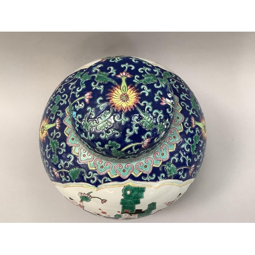 31 - A 20th century Chinese ginger jar and cover painted with reserves of mother with sons in a garden la... 