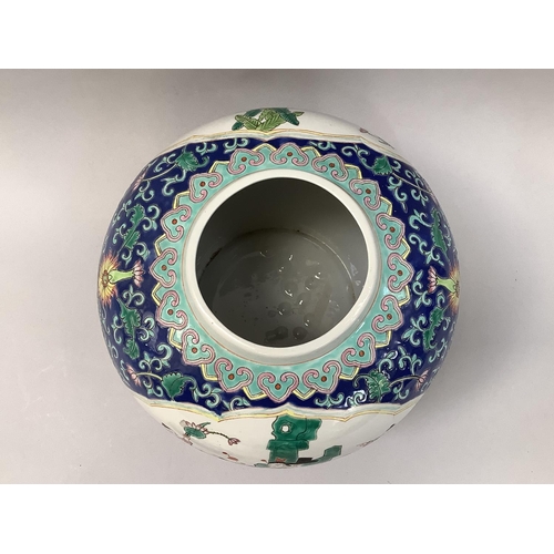 31 - A 20th century Chinese ginger jar and cover painted with reserves of mother with sons in a garden la... 