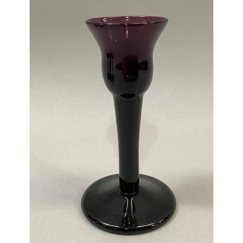 35 - A set of six amethyst glass liqueurs, 11.5cm, having a bell shaped bowl and on folded foot