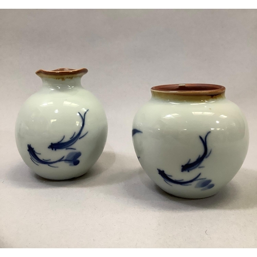 49 - A pair of Jingdezhen blue and white porcelain tea or coffee cups, each with floral decoration, marke... 