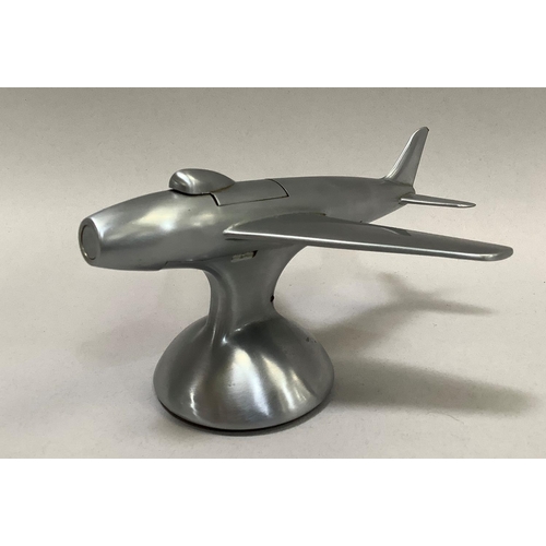 1 - A 1950s Dunhill table lighter in the shape of a Sabre F-86 jet fighter in a brushed chrome finish, t... 