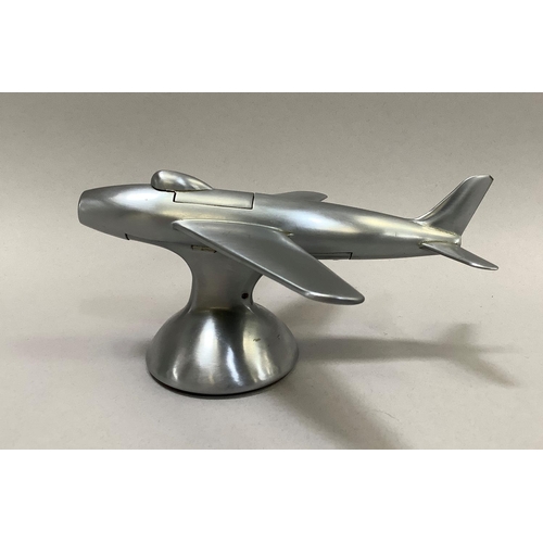 1 - A 1950s Dunhill table lighter in the shape of a Sabre F-86 jet fighter in a brushed chrome finish, t... 