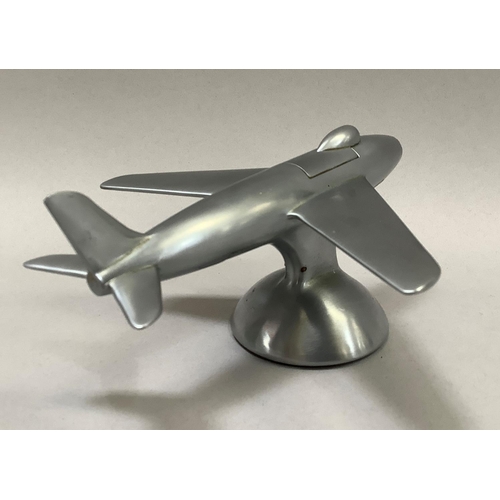 1 - A 1950s Dunhill table lighter in the shape of a Sabre F-86 jet fighter in a brushed chrome finish, t... 