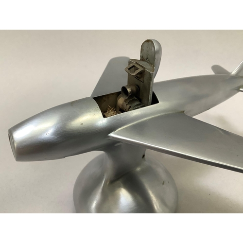 1 - A 1950s Dunhill table lighter in the shape of a Sabre F-86 jet fighter in a brushed chrome finish, t... 
