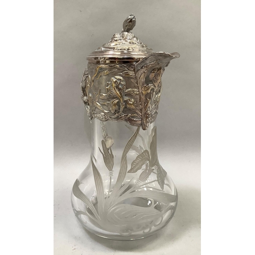 40 - A silver-plated topped etched glass claret jug by Topazio Casquinha, with relief foliate decoration,... 