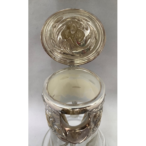 40 - A silver-plated topped etched glass claret jug by Topazio Casquinha, with relief foliate decoration,... 