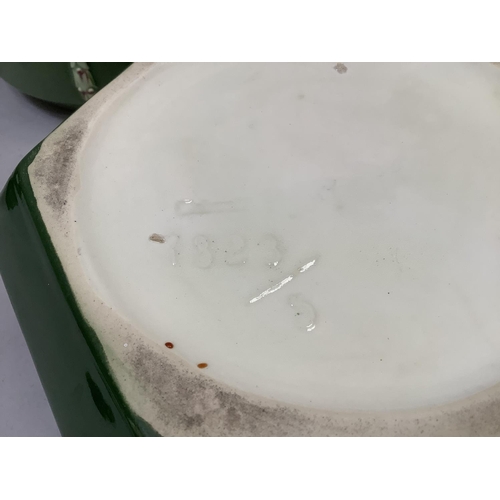 19 - An Eichwald comport of circular outline raised on a centre pedestal and three outer strapwork pedest... 