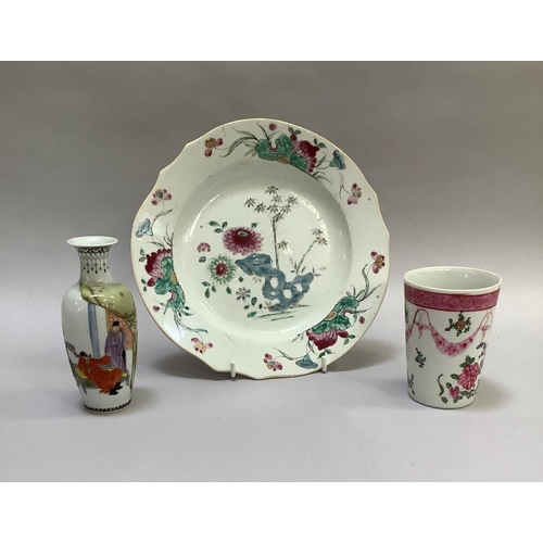46 - An 18th century Chinese famille rose plate enamelled with racks issuing chrysanthemum and bamboo, 23... 